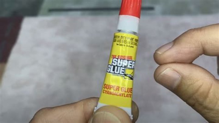 What removes super glue from skin?