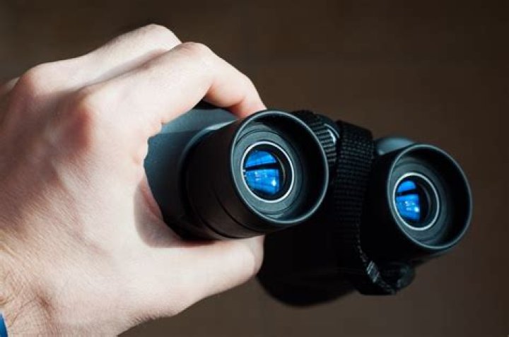 Why prisms are used in binoculars?